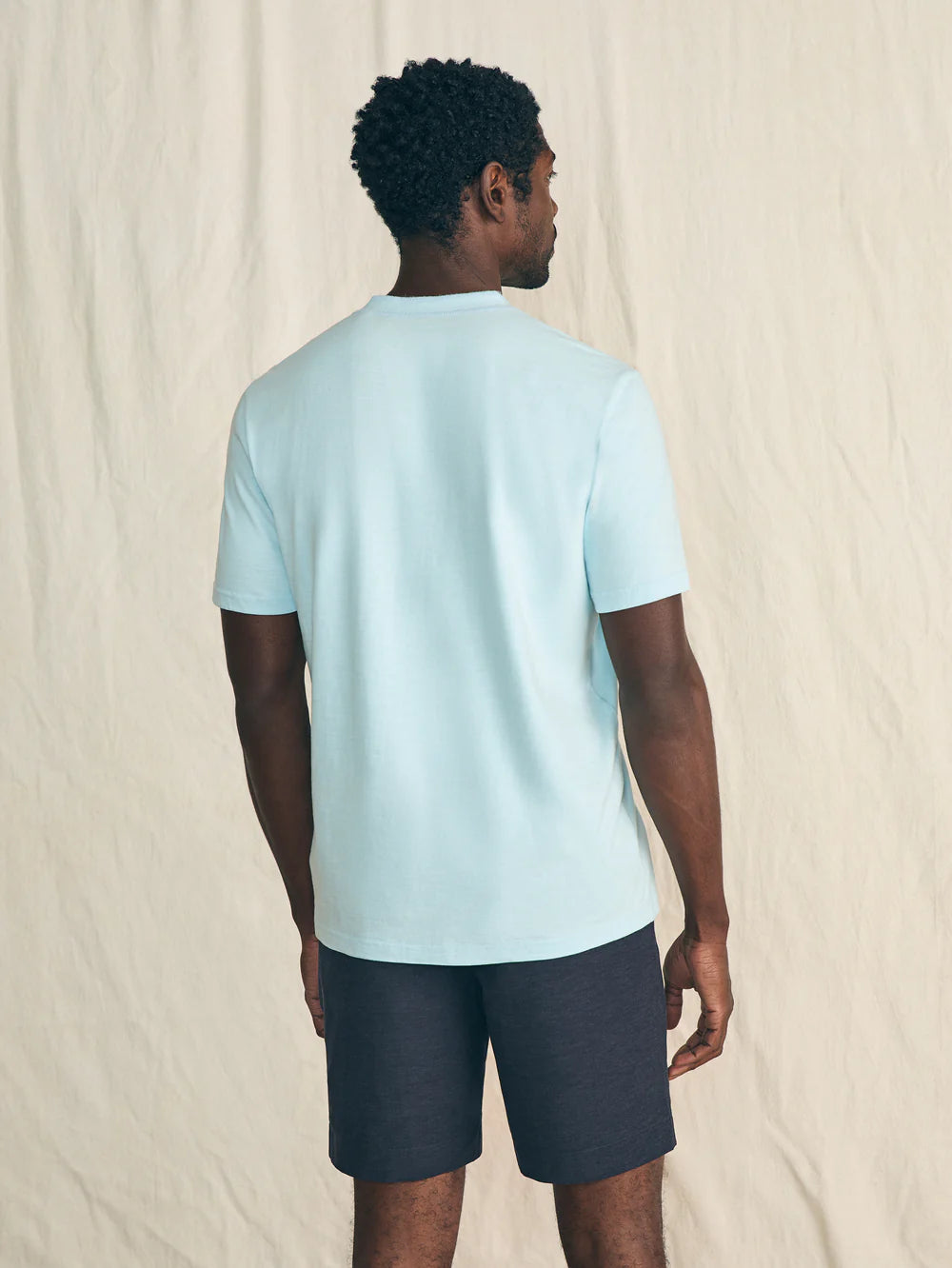 Back view of the Blue Oasis Short Sleeve Sunwashed Henley by Faherty