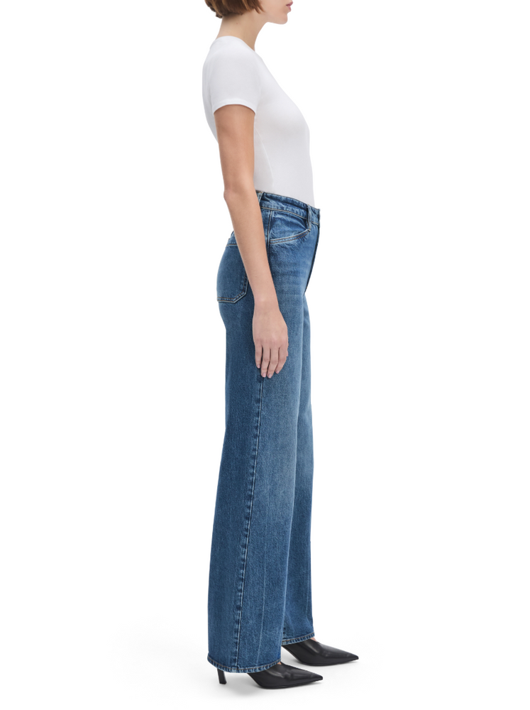 
                      
                        Woman wearing a white t-shirt and blue jeans from Favorite Daughter
                      
                    