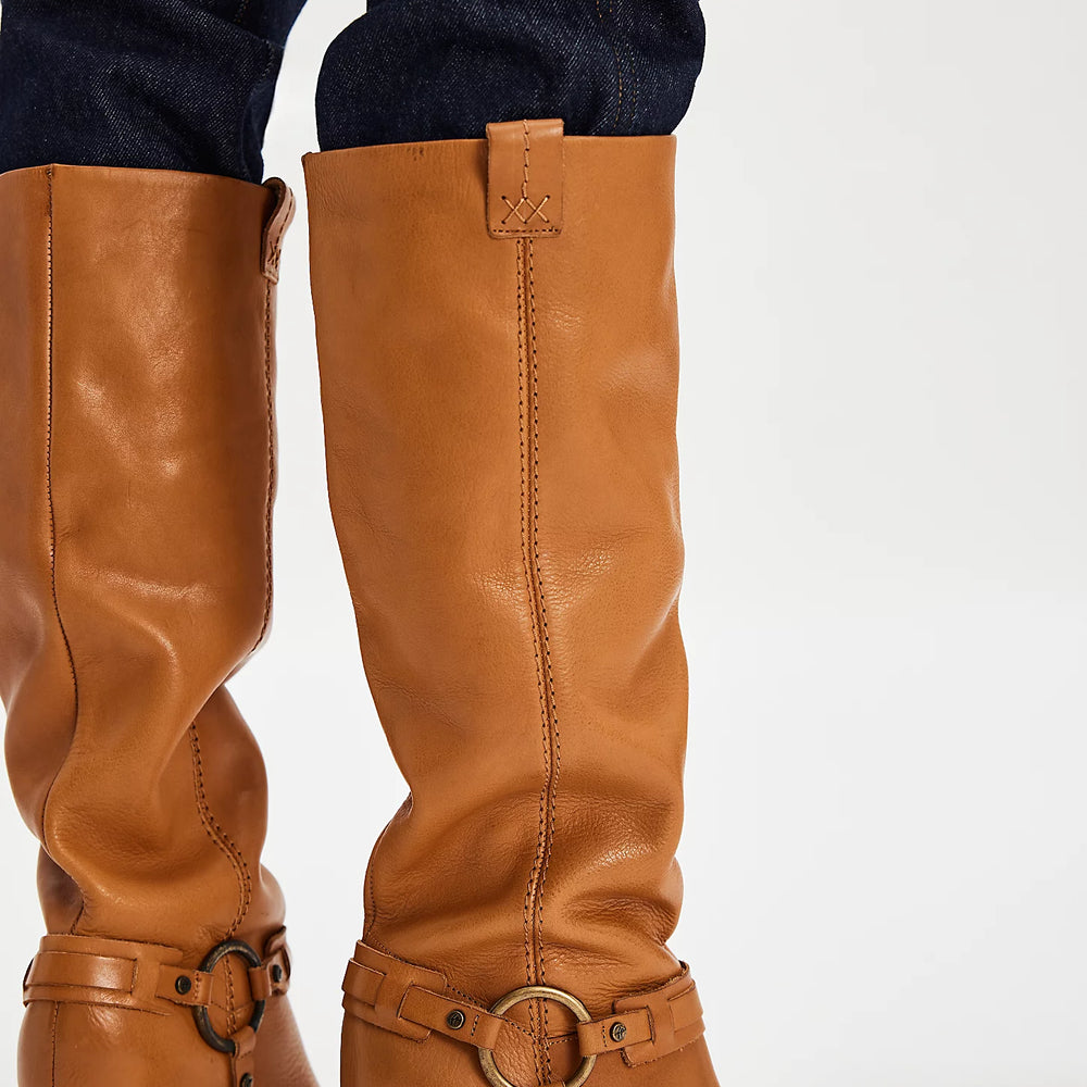 Embrace the classic cool style of these tall leather boots from Free People, now at Harbour Thread boutique