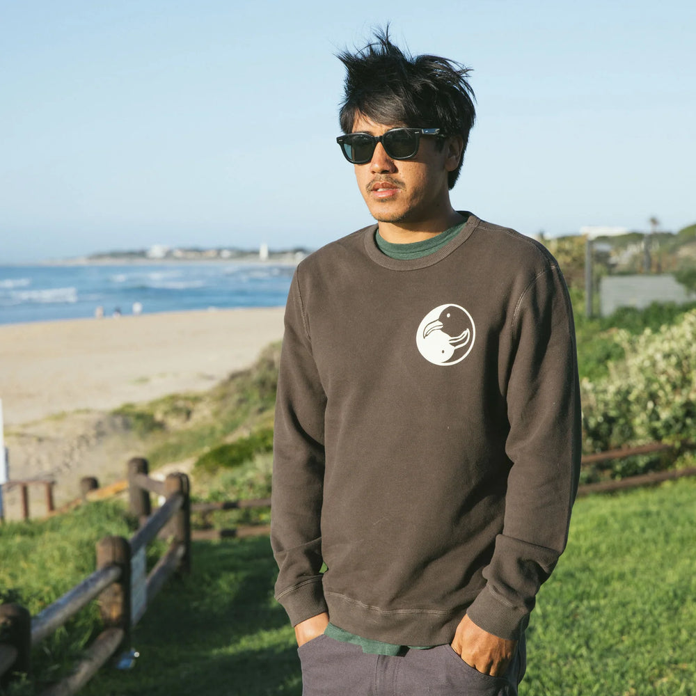 
                      
                        front of men's faded black long sleeve pullover with chest graphic
                      
                    