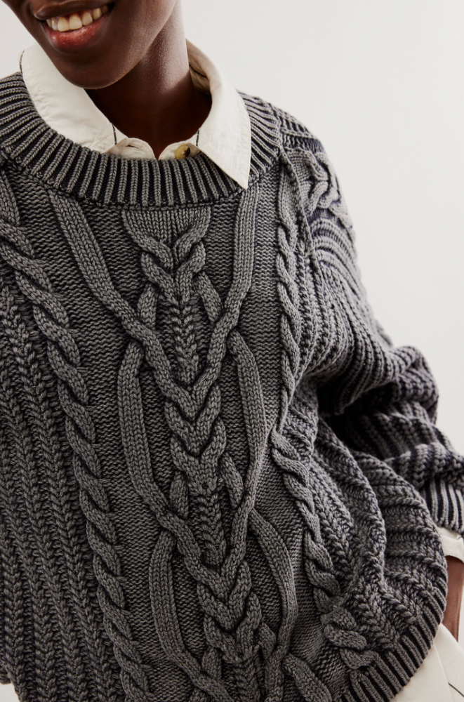 
                      
                        Front design detail on the Black Frankie Cable Sweater by Free People
                      
                    