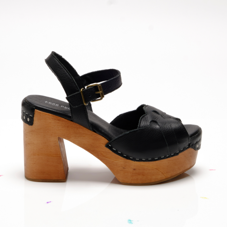 Side view of Free People's Black Orion Clogs