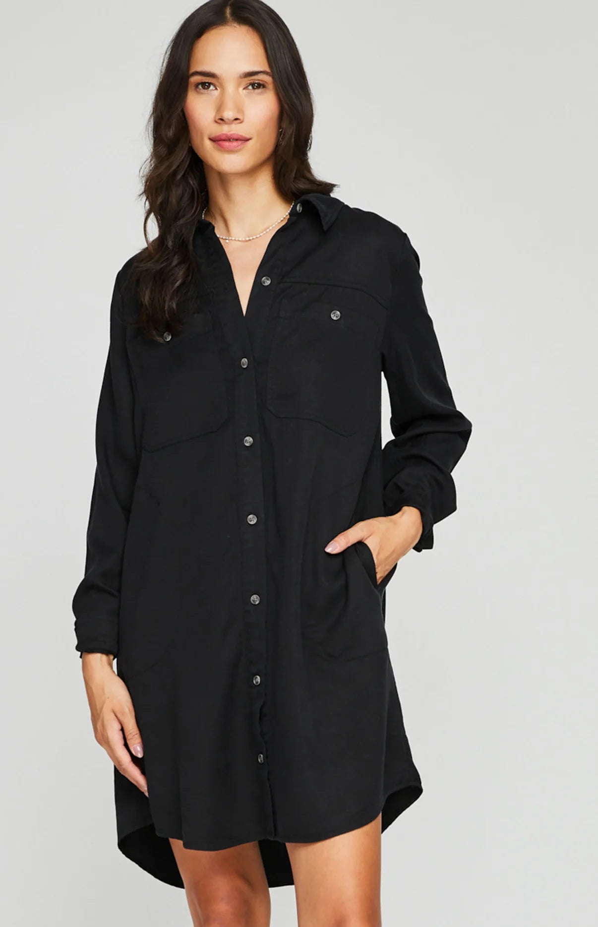 Load image into Gallery viewer, Front view of woman wearing a black button up shirt dress

