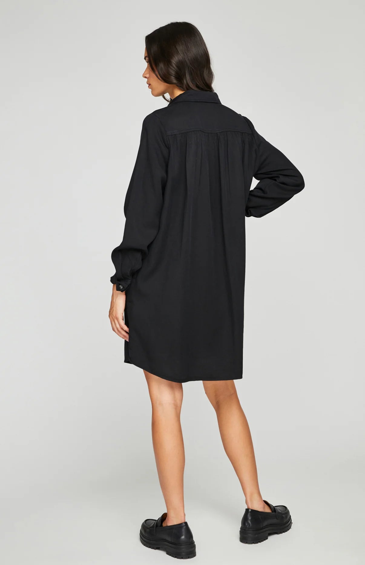 Load image into Gallery viewer, back view of woman wearing a black button up shirt dress
