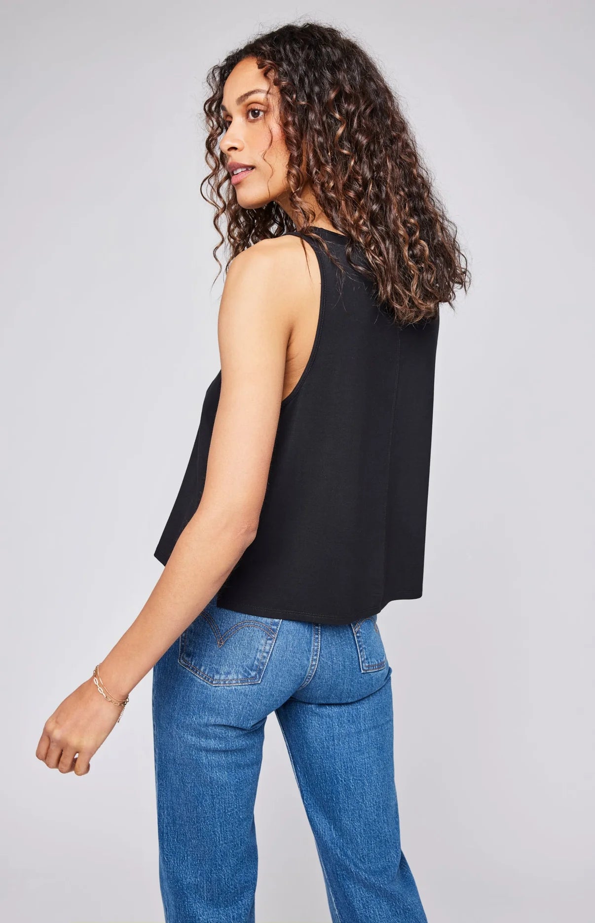 Back view of a woman wearing the Black relaxed fit Diana Tank by Gentle Fawn