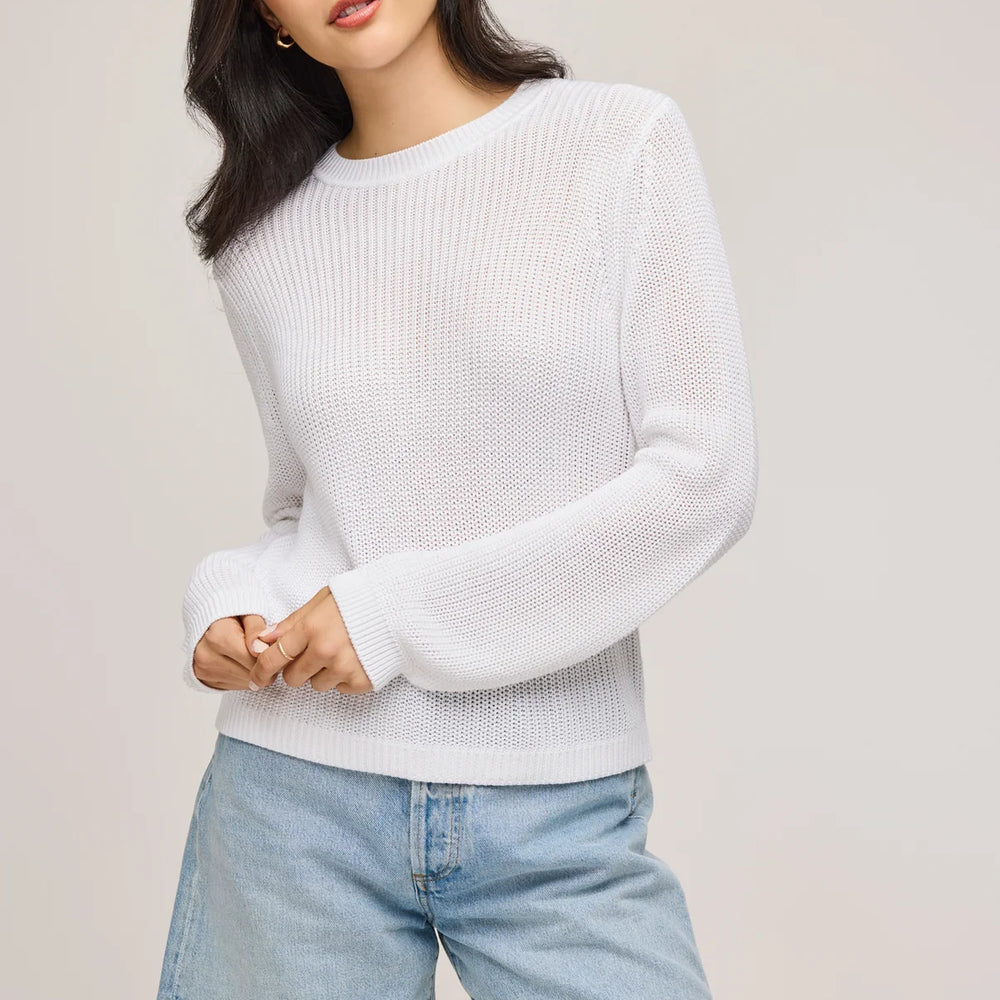 A woman wearing the White Maxine Pullover Sweater by Gentle Fawn