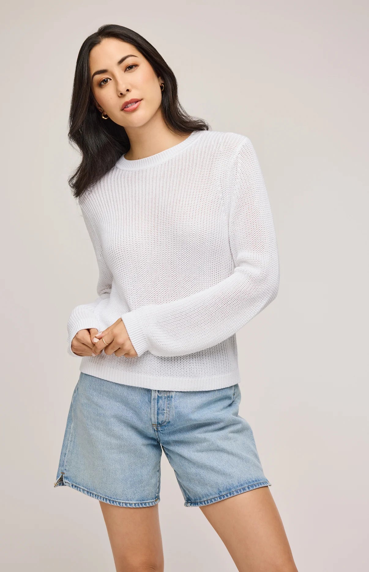 A woman wearing the White Maxine Pullover Sweater by Gentle Fawn