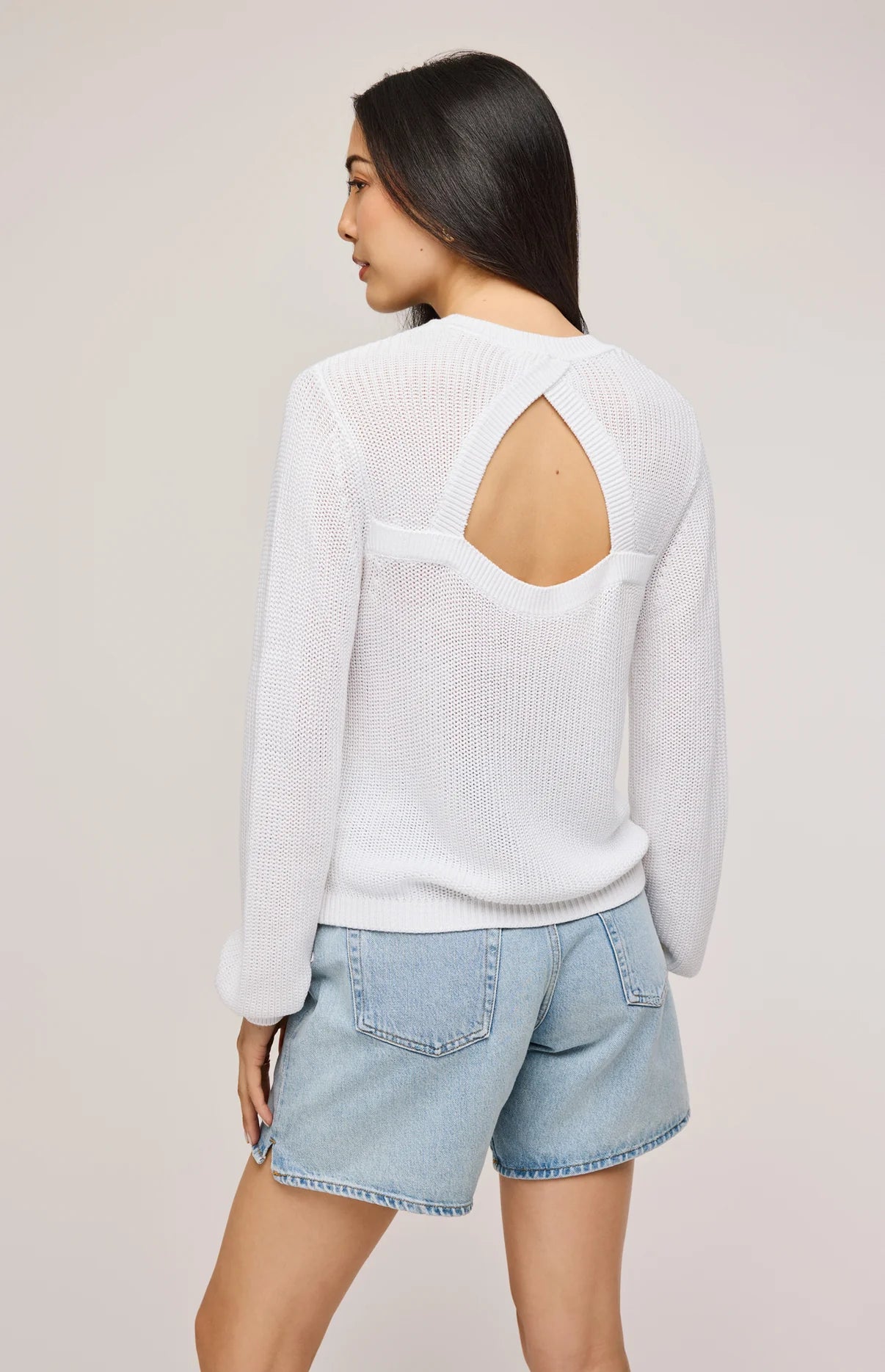 The White Maxine Pullover Sweater by Gentle Fawn features a back cut-out detail