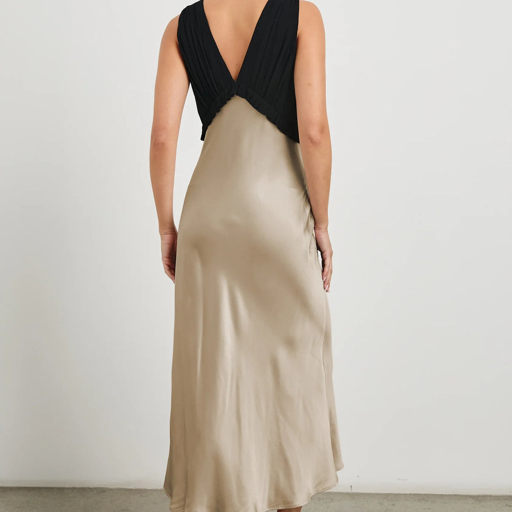 
                      
                        The Gilda Dress features a v-front and back
                      
                    