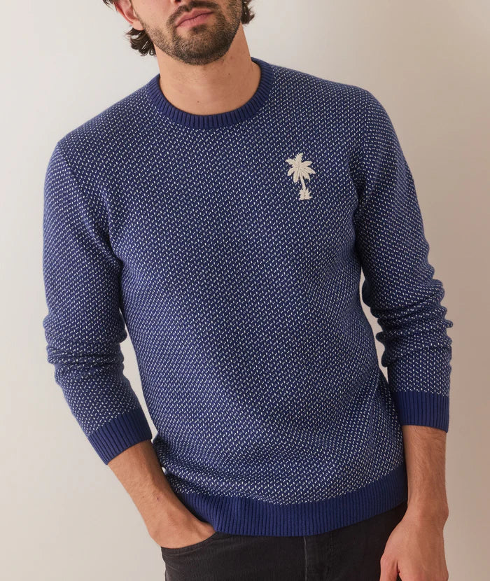 This cool crewneck sweater from Marine Layer offers a subtle bird’s eye stitch for a textured look with an embroidered palm tree detail.&nbsp;