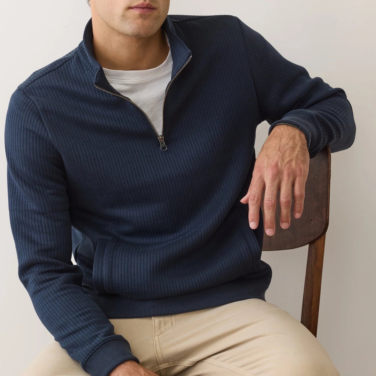 A man wearing the Corbet Quilted Quarter Zip by Marine Layer