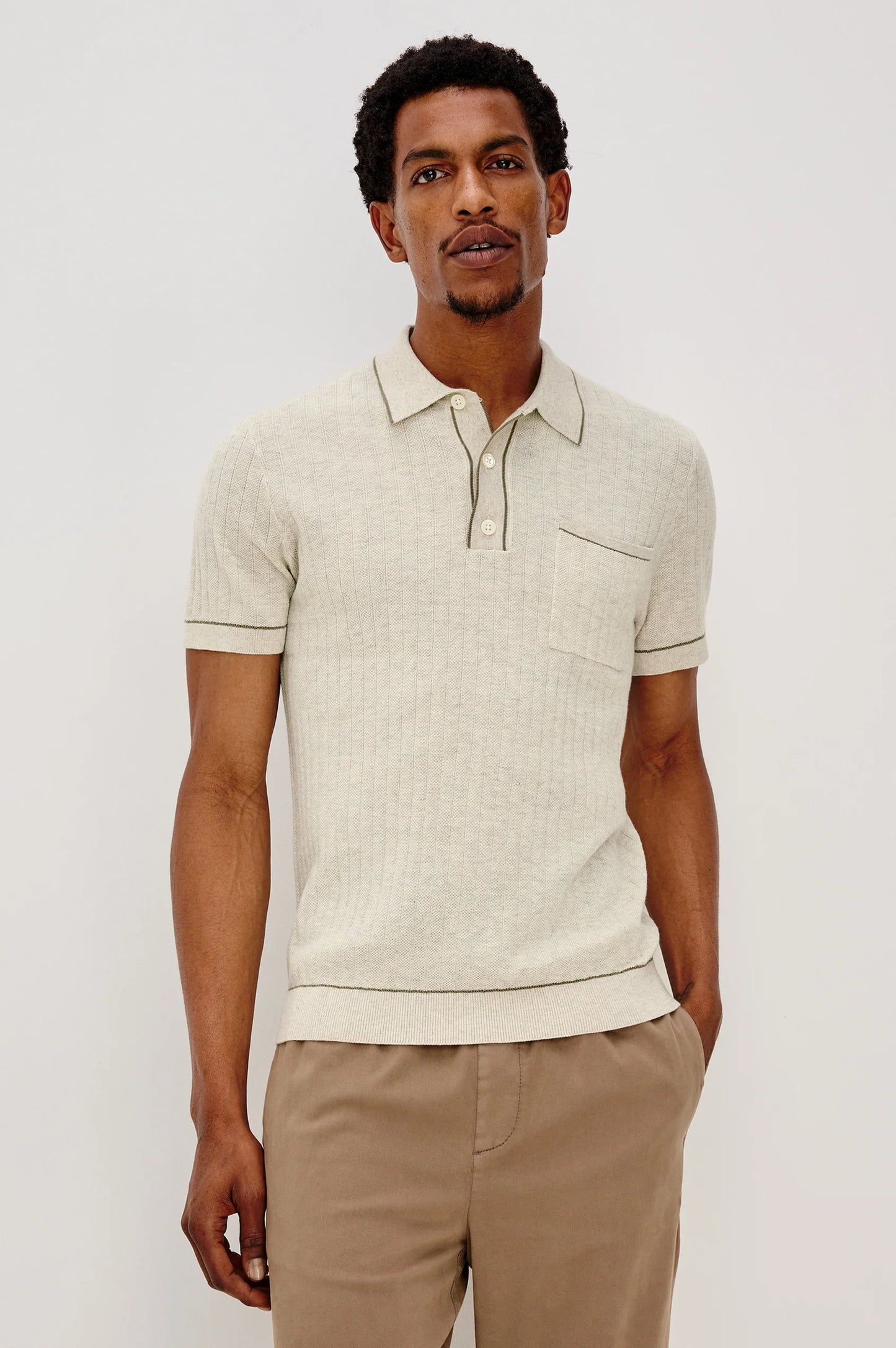 A man wearing the The Rails Hardy Polo Shirt in Oat Heather