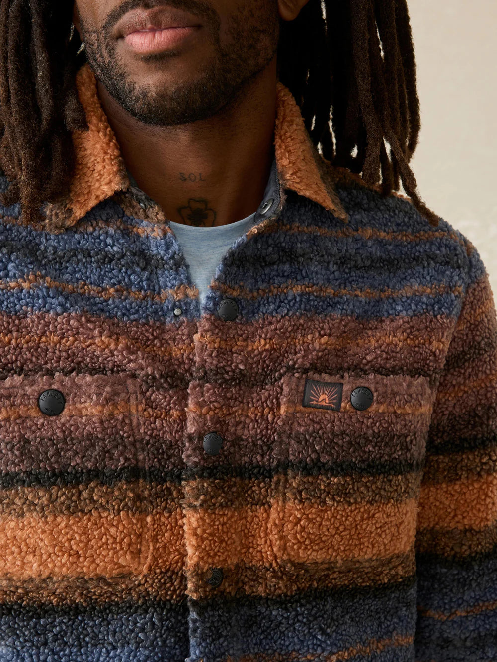 Faherty's Range Fleece CPO features patch pockets at the chest with snap closure