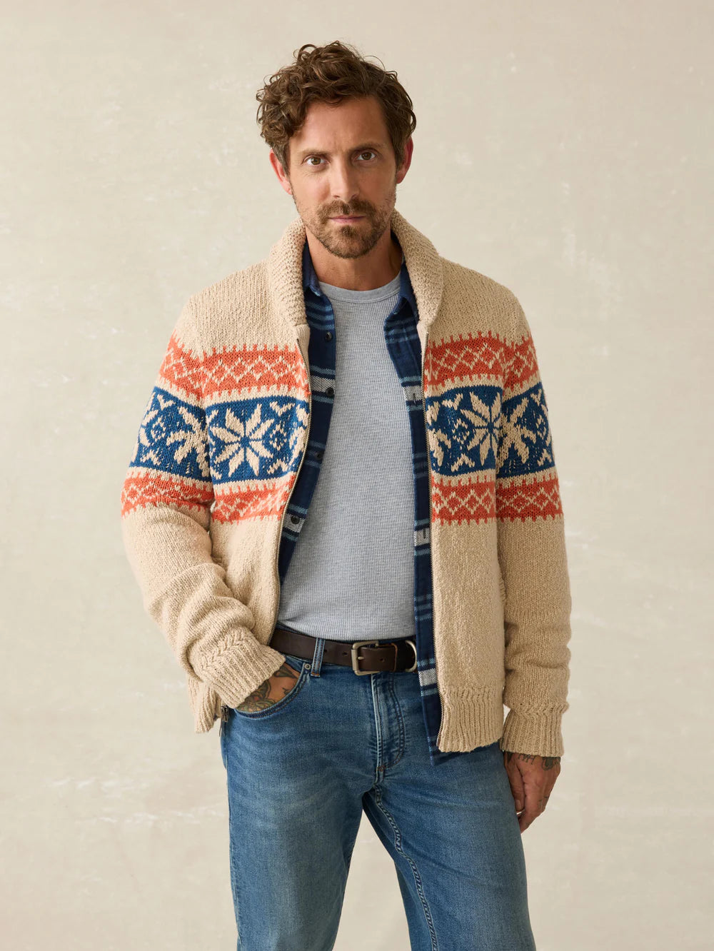 A man wearing Faherty's Surf To Snow Zip Cardigan