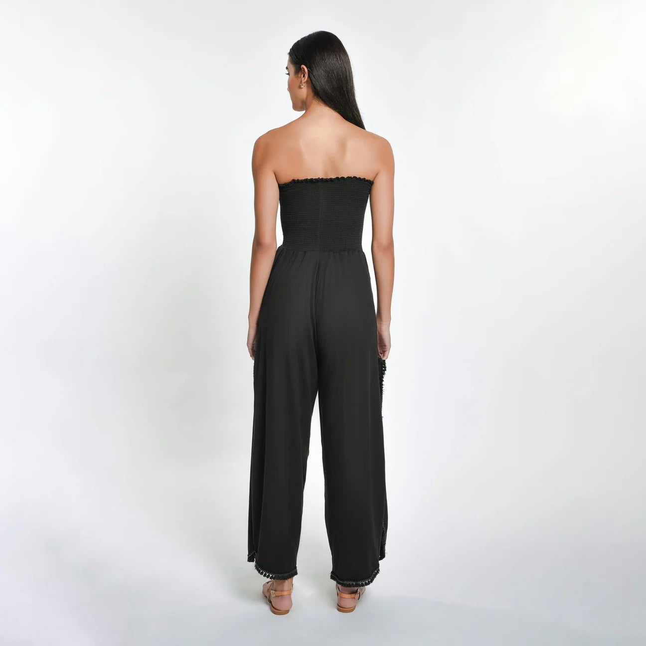 Back view of the the black Harriet Strapless Jumpsuit by Peixoto
