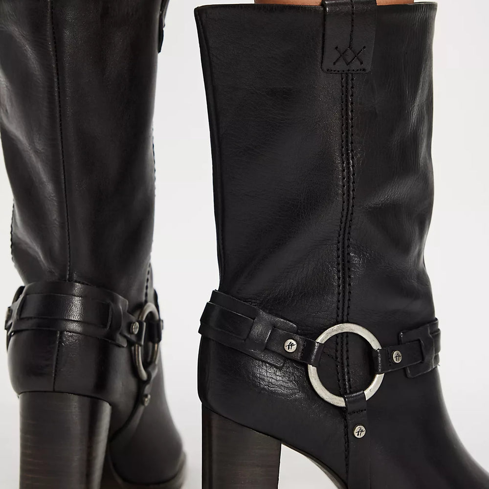 Add some edge to any outfit with these mid-calf black leather boots from Free People, now at Harbour Thread boutique.