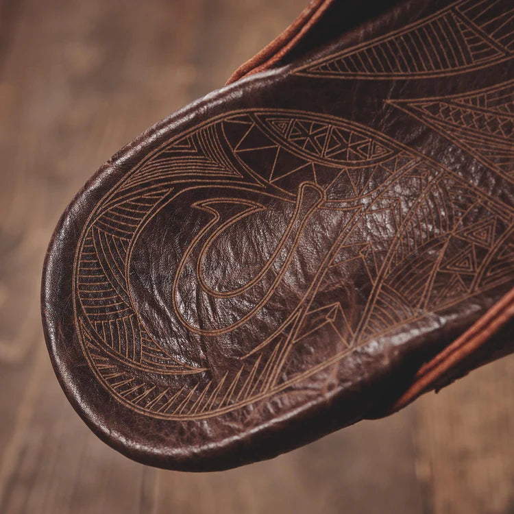 
                      
                        The OluKai Hiapo Sandals feature traditional Polynesian tattoo artwork
                      
                    