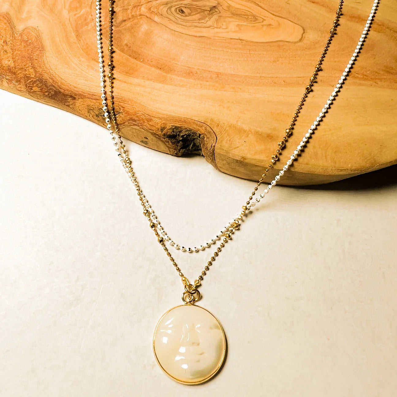 Detail on the Double Chain Moon Mother Necklace by Santore Jewelry