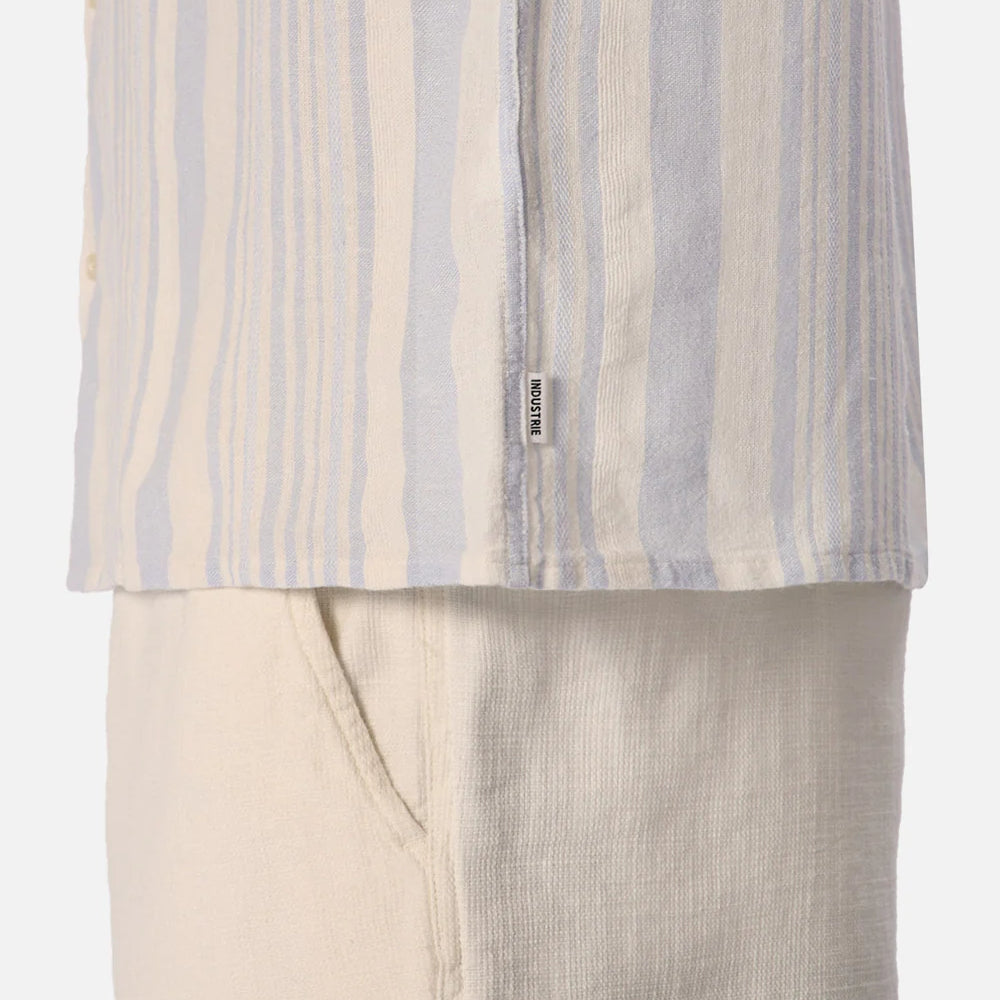 
                      
                        Striped shirt and beige pants on a white background
                      
                    
