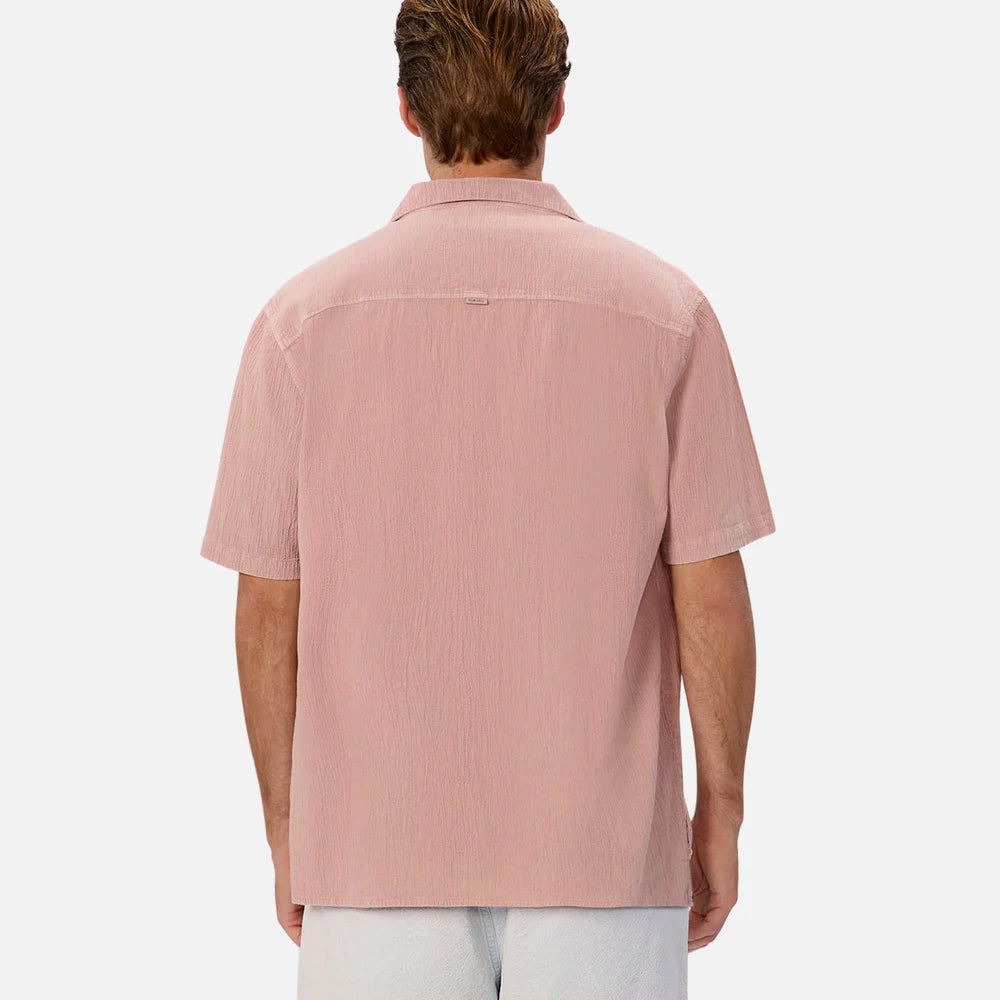 
                      
                        Man wearing The Washed Magna Short Sleeve Shirt by the brand Industrie in the color Musk 24. 
                      
                    