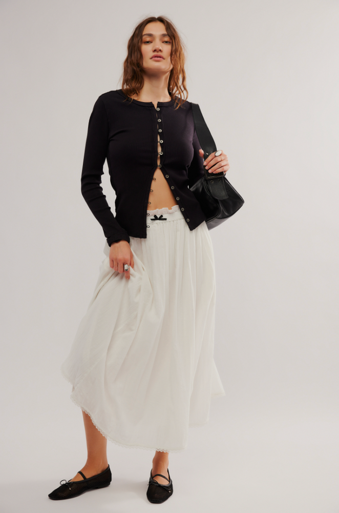 
                      
                        An outfit styled with the Black  It's On Cardi by Free People
                      
                    