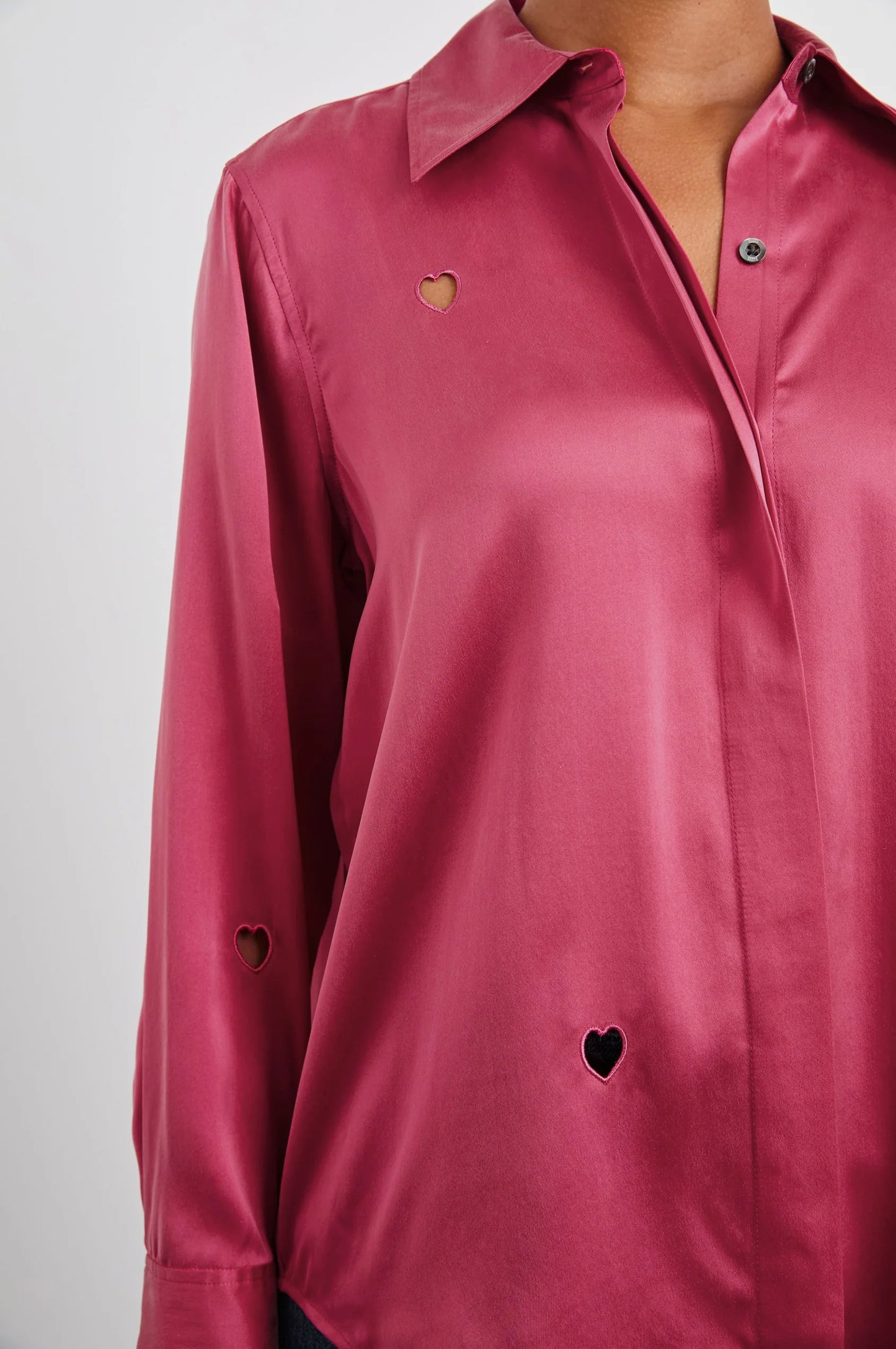 Women's pink satin button down shirt with heart cut-out details