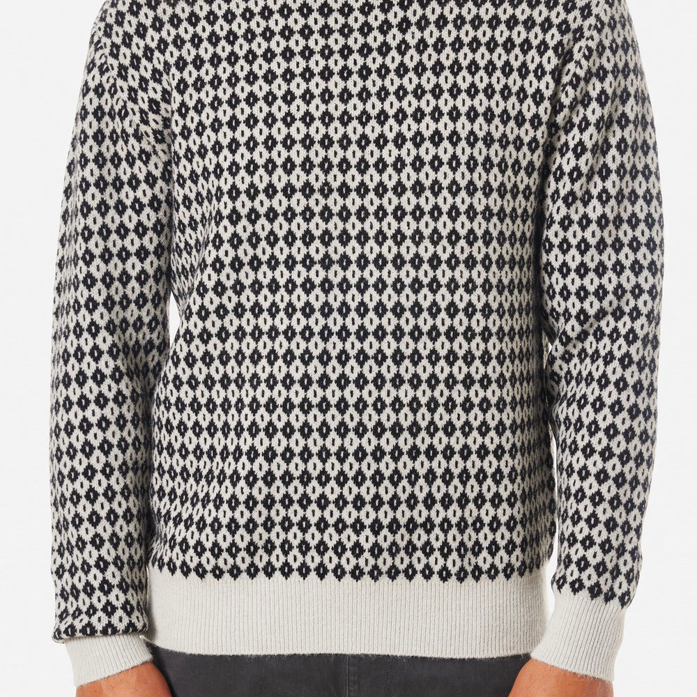 Front view of a man wearing the Black Wash Check Sweater by Katin