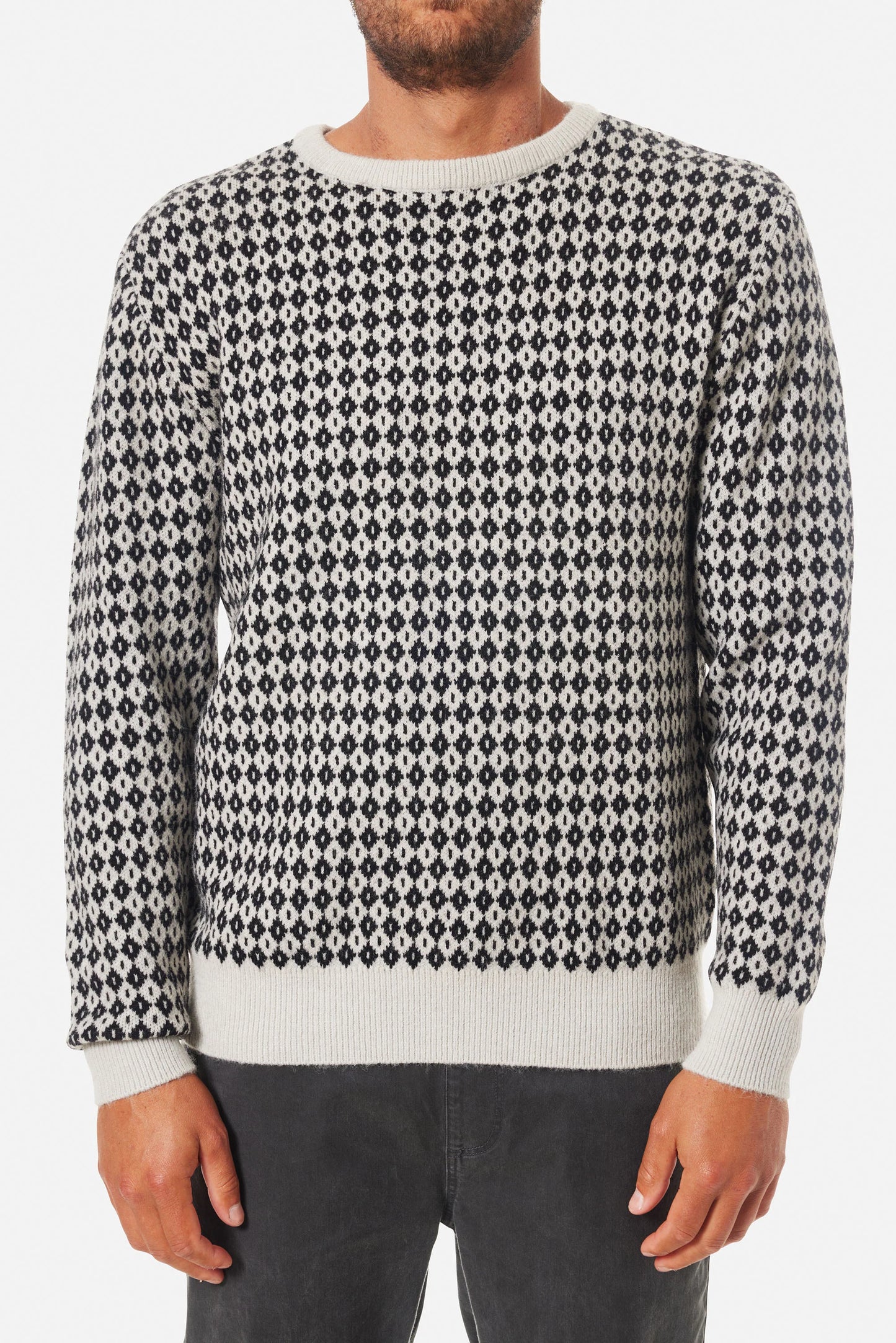 Front view of a man wearing the Black Wash Check Sweater by Katin