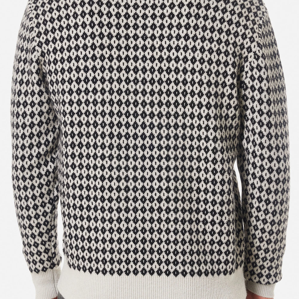 Back view of a man wearing the Black Wash Check Sweater by Katin