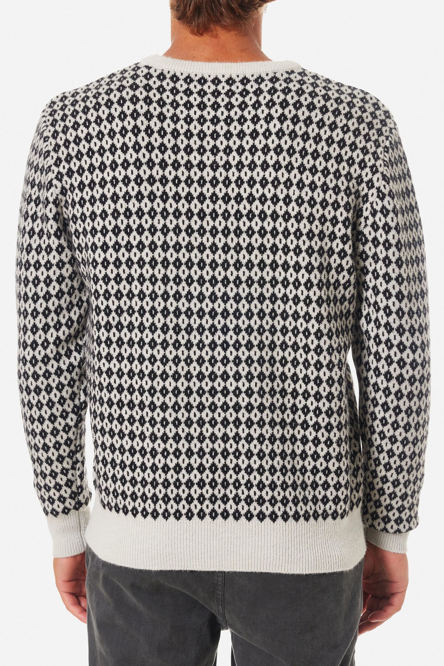 Back view of a man wearing the Black Wash Check Sweater by Katin