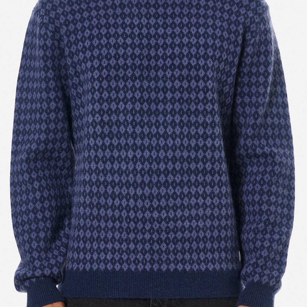 
                      
                        Person wearing a blue patterned sweater from Katin
                      
                    