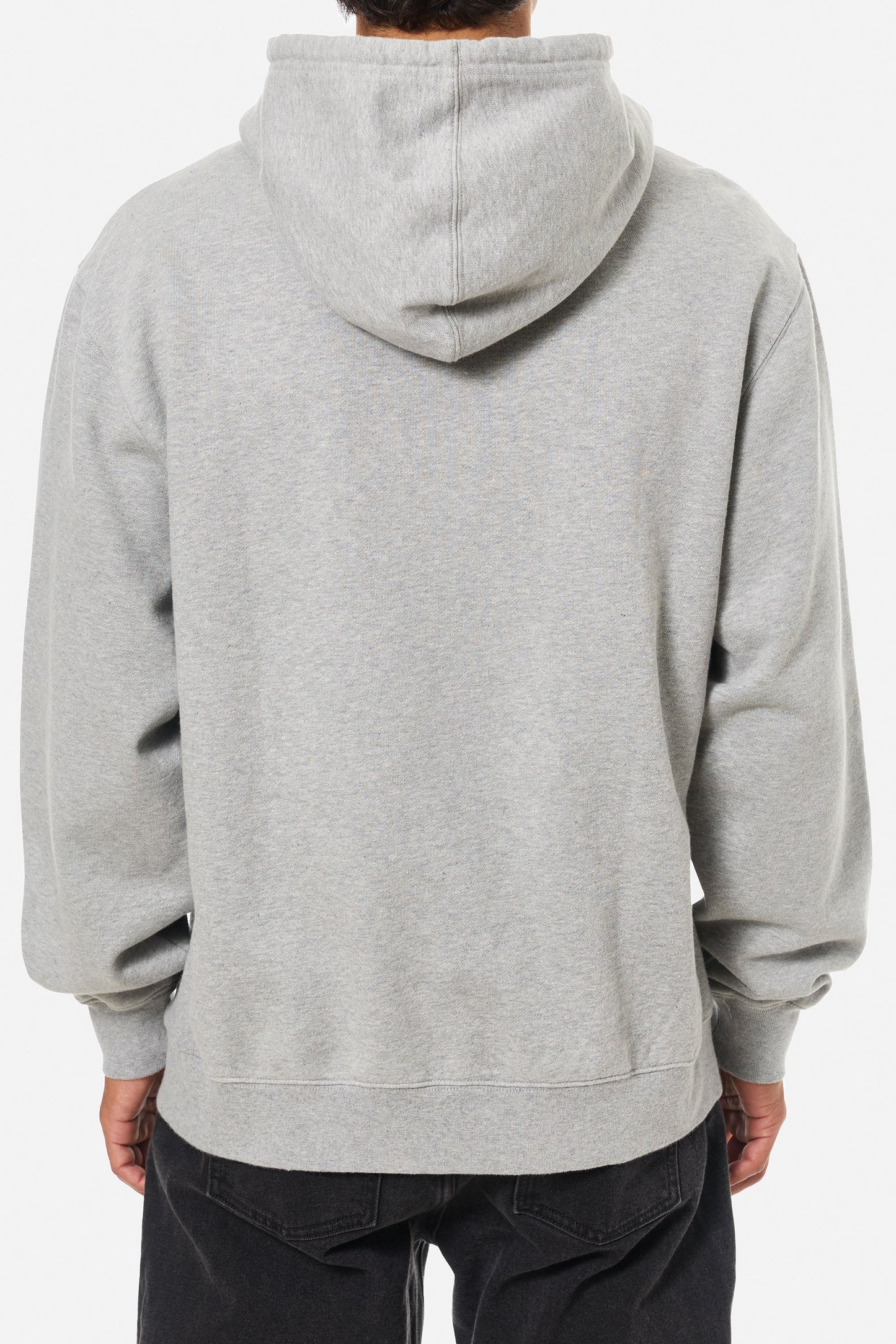 A man wearing the Heather Gray Embroidered Hoodie by Katin