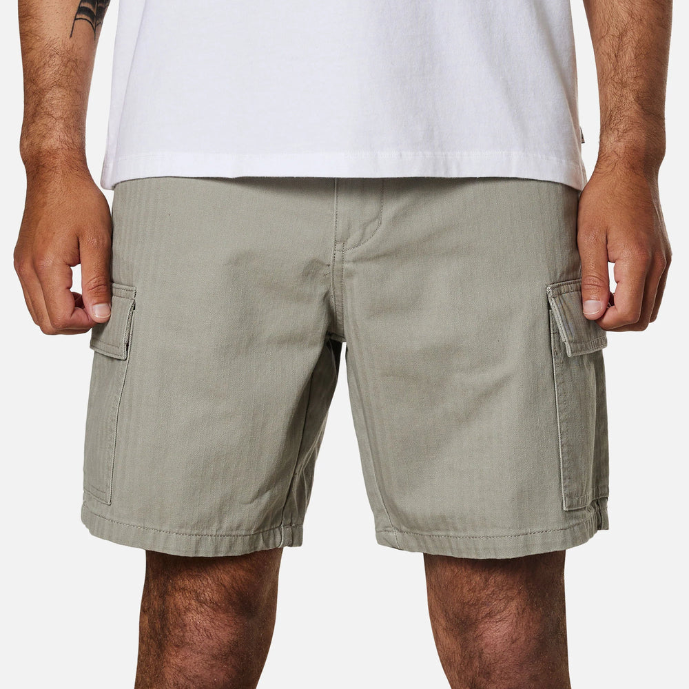 Front view of a man wearing the warm grey colored men's cargo shorts by Katin