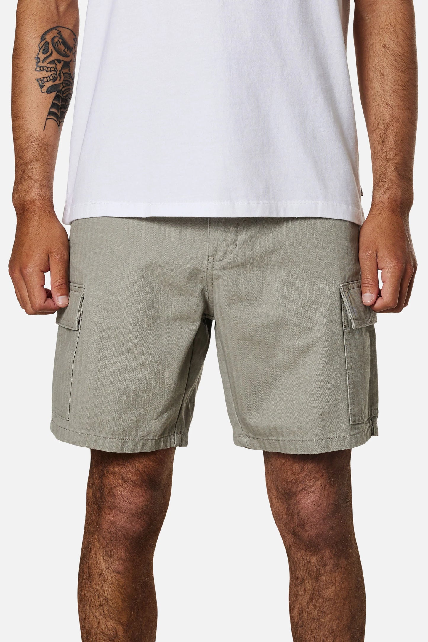 Front view of a man wearing the warm grey colored men's cargo shorts by Katin