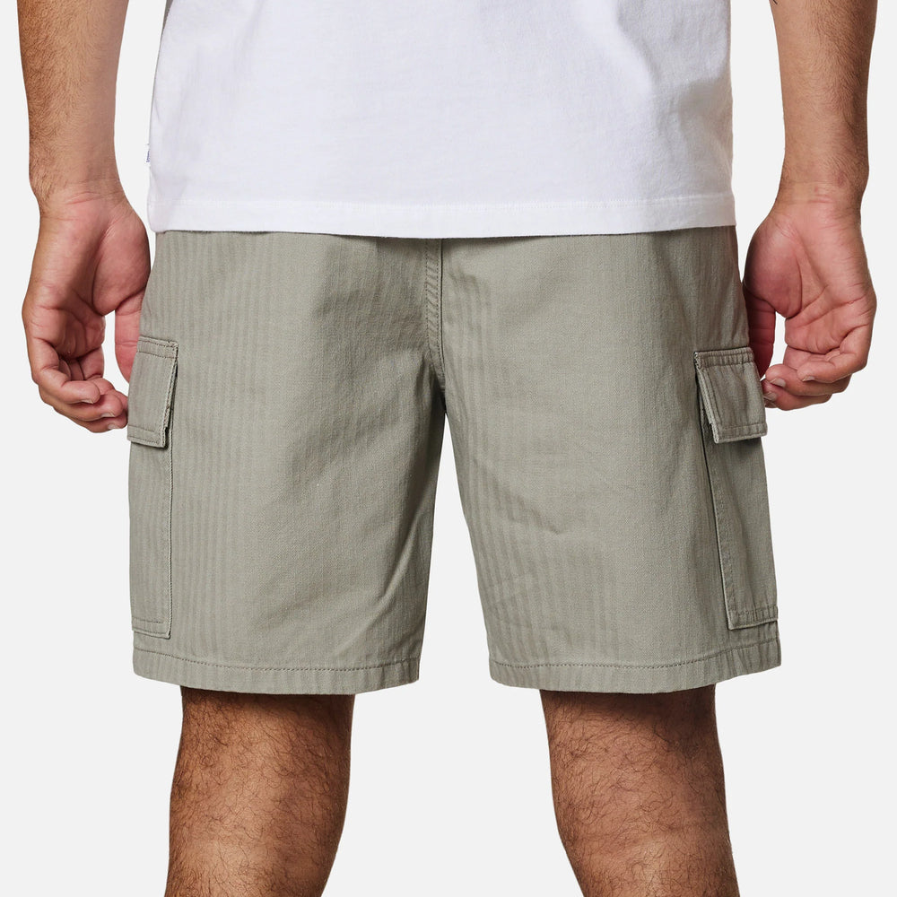 Back view of a man wearing the warm grey colored men's cargo shorts by Katin