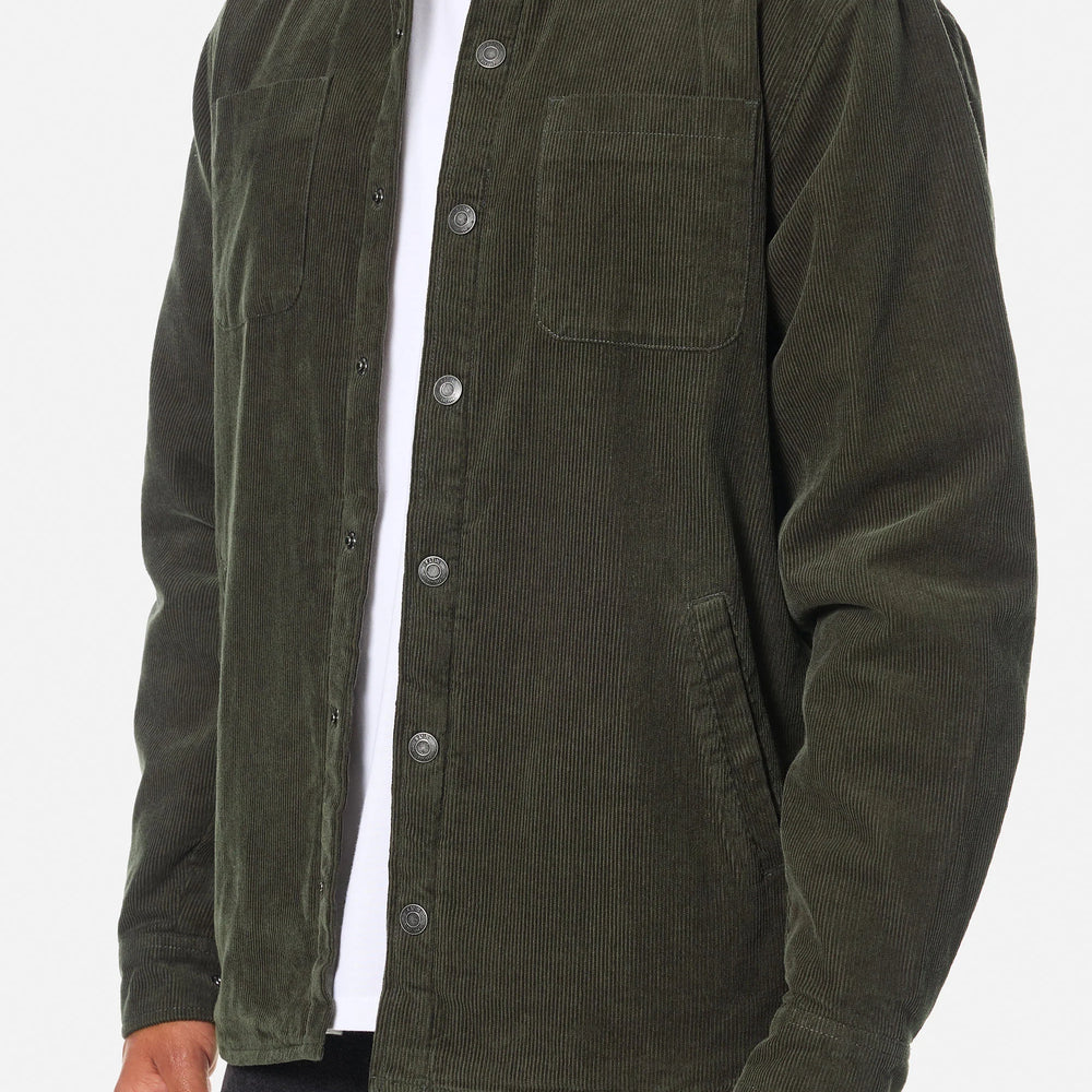
                      
                        Man wearing a dark green shirt jacket
                      
                    