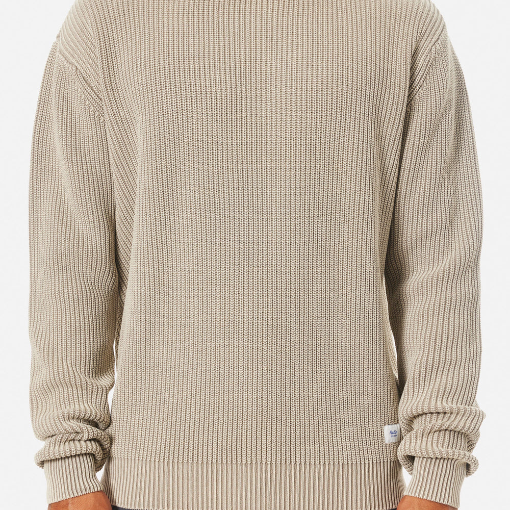 
                      
                        Man wearing a beige knit crewneck sweater from Katin
                      
                    