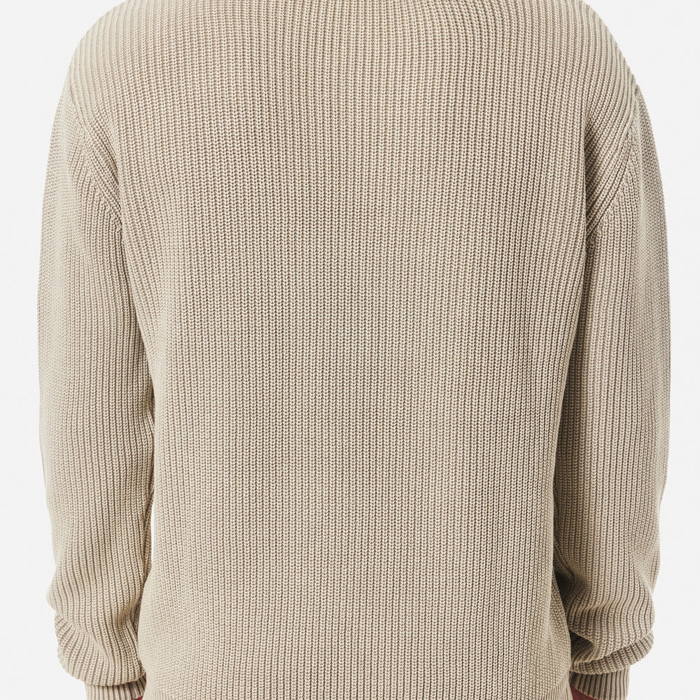 
                      
                        Man wearing a beige ribbed sweater from Katin
                      
                    