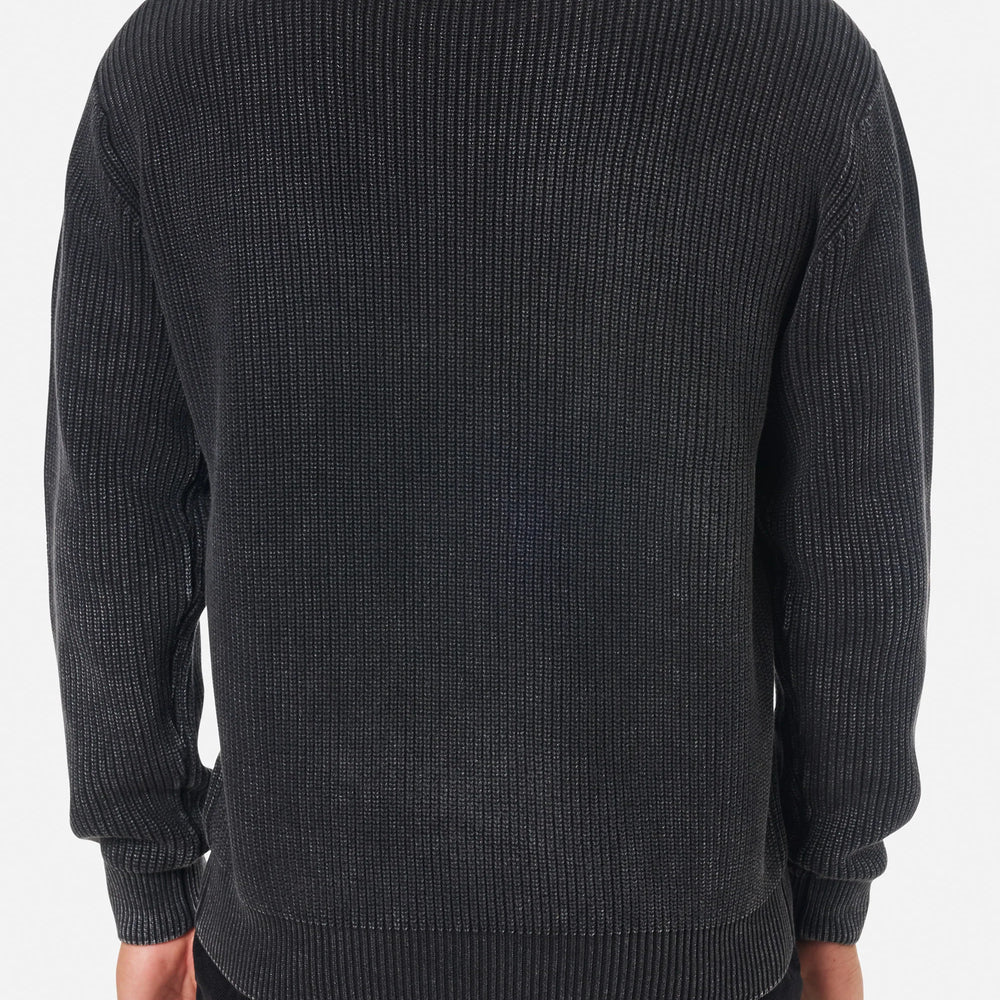 
                      
                        Man wearing the black wash Swell Sweater by Katin
                      
                    