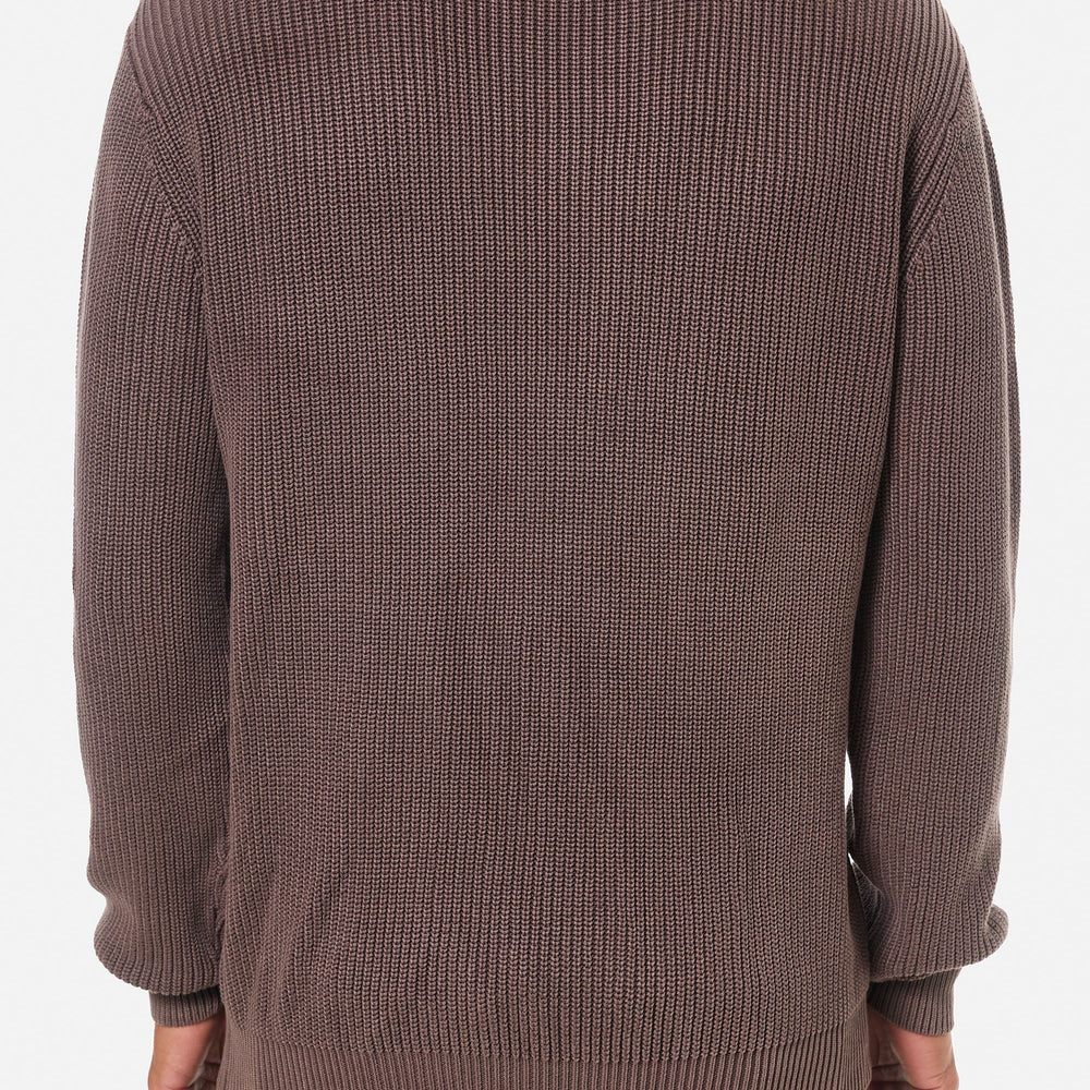 
                      
                        Man wearing a plum ribbed knit sweater from Katin
                      
                    