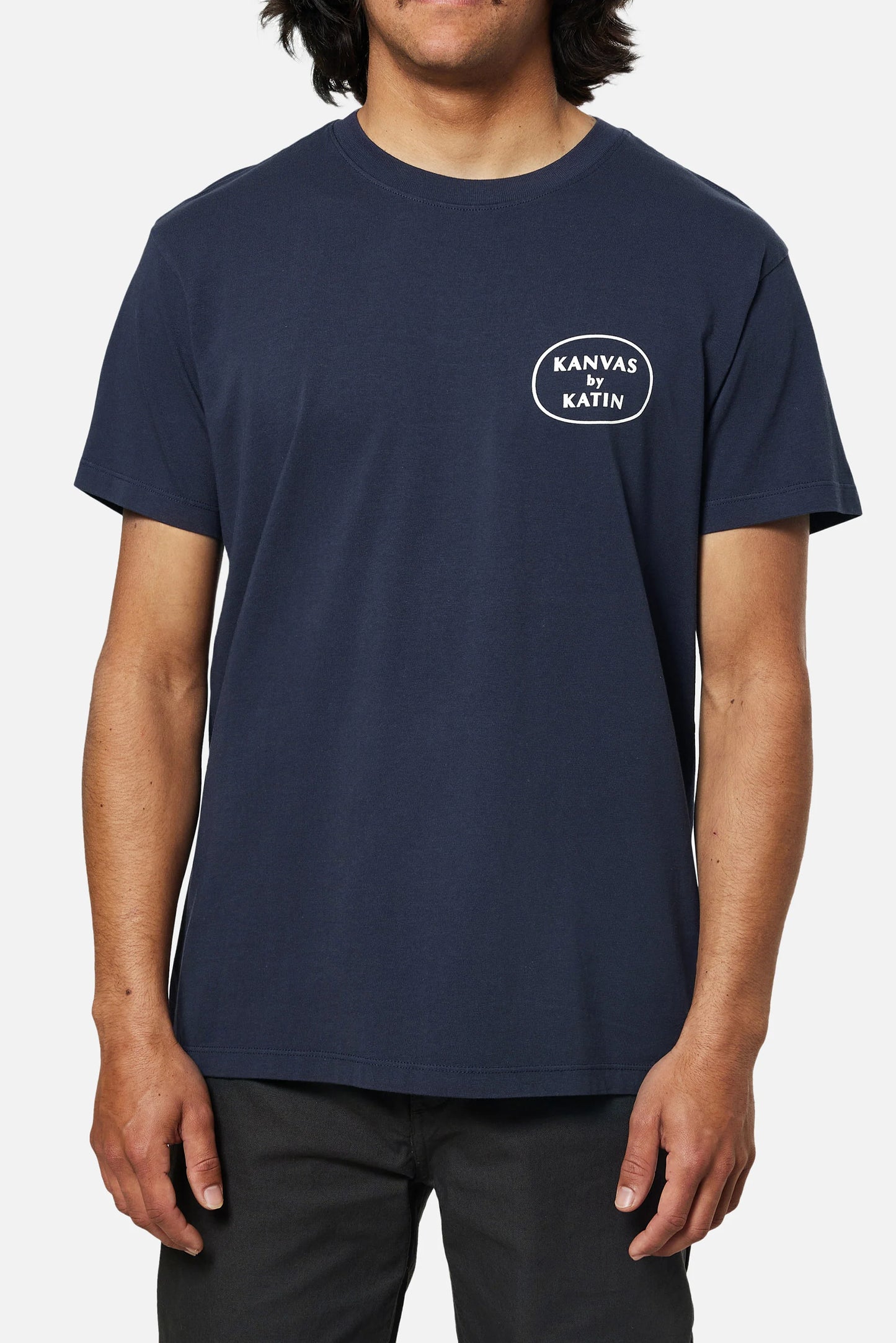 Front view of man wearing the navy short sleeve Trimming Tee by Katin. 