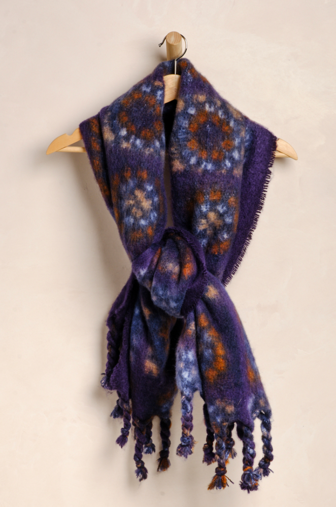 
                      
                        Free People's Kaleidoscope Blanket Scarf is a versatile fall accessory
                      
                    