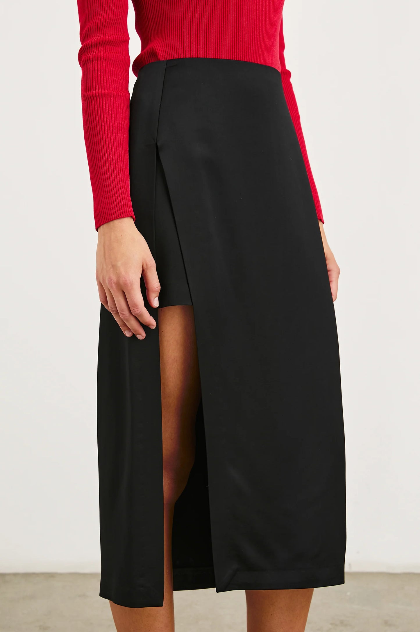 This unique pencil skirt offers a high waisted fit