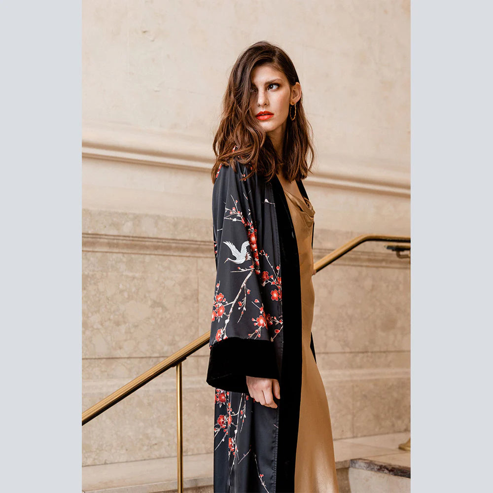 With beautiful velvet trim and a beautiful cherry blossom design, this lovely kimono robe from KIM+ONO offers a slightly heavier weight, making it a perfect cover up for nights out.