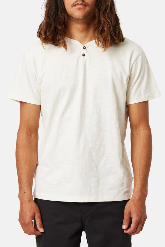 Front view of a man wearing a white short sleeve henley shirt by Katin