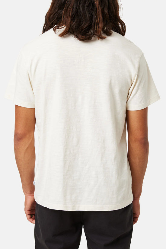 Back view of a man wearing a white short sleeve henley shirt by Katin