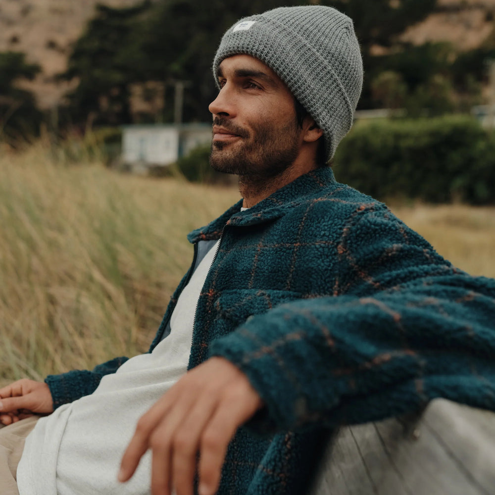 Man wearing a grey beanie by Katin 