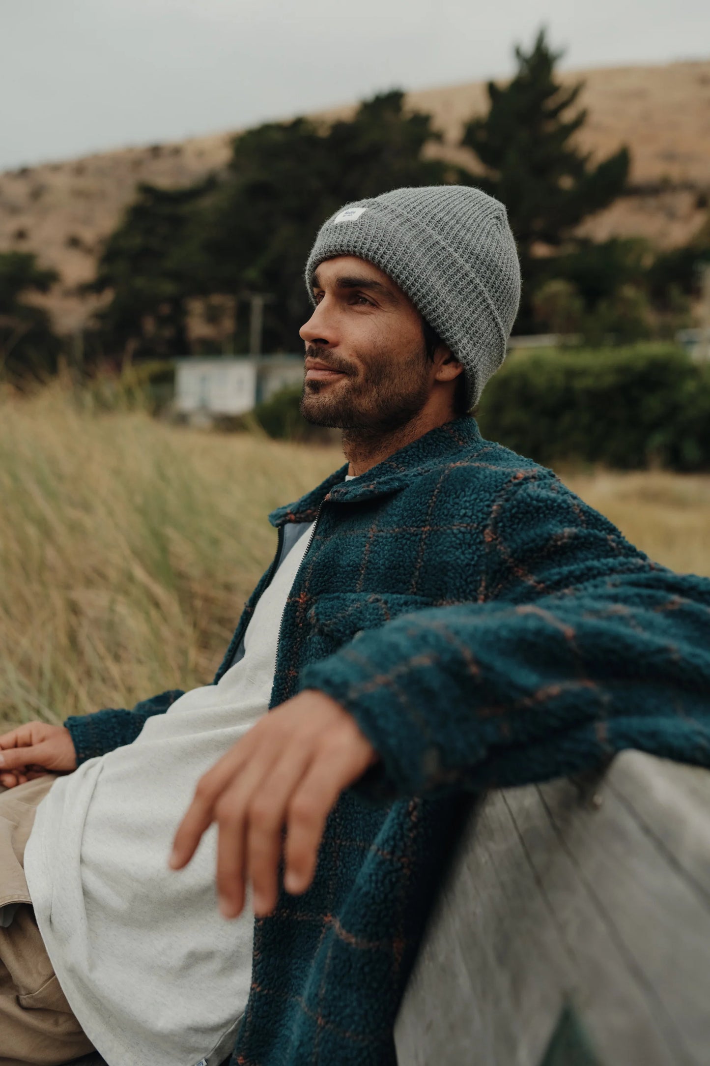 Man wearing a grey beanie by Katin 