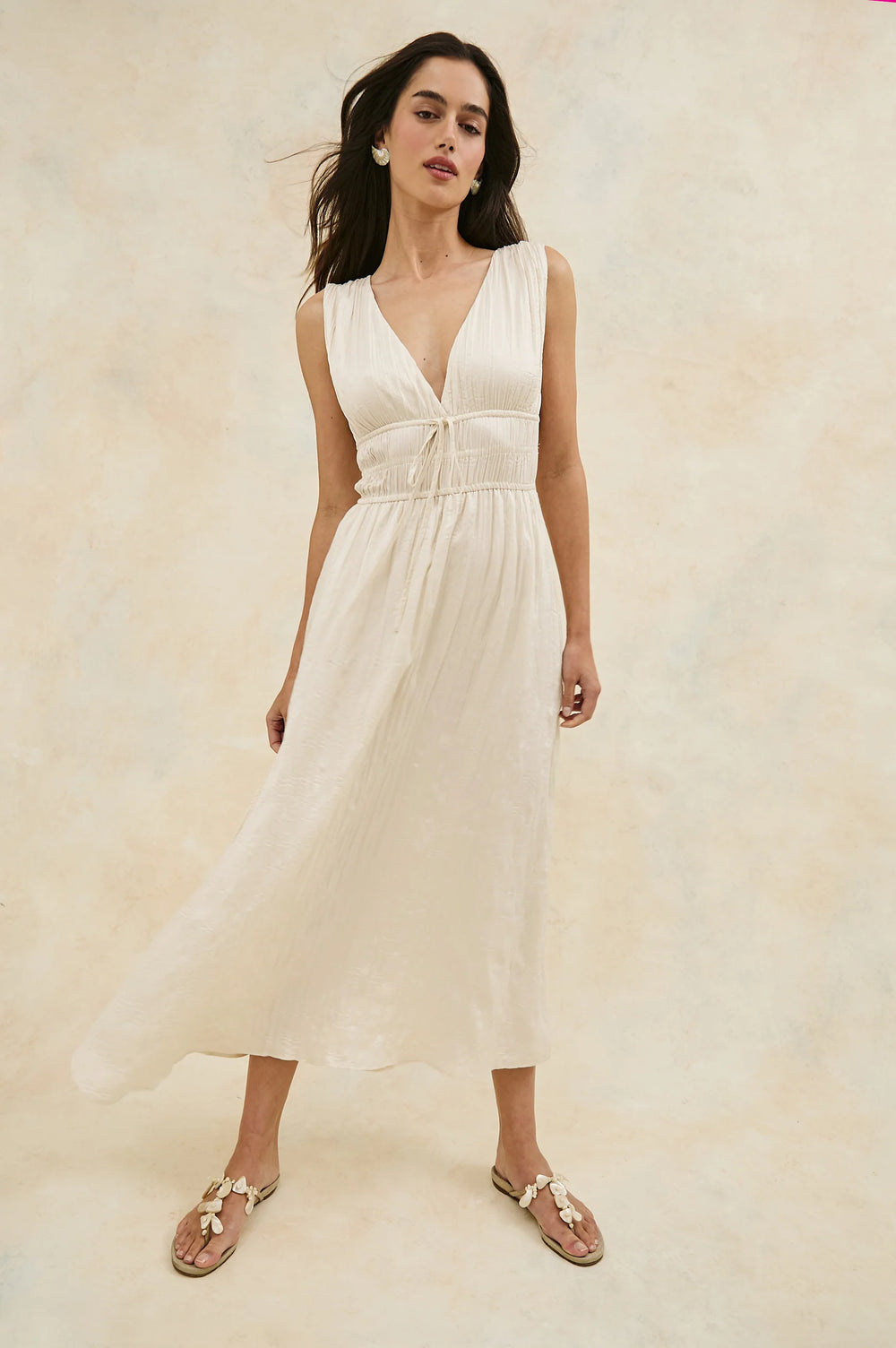 The Rails Lilith Dress is a striking midi style with a plunging neckline for a look that will turn heads at any event. Find yours at Harbour Thread boutique in St. Pete, FL. 