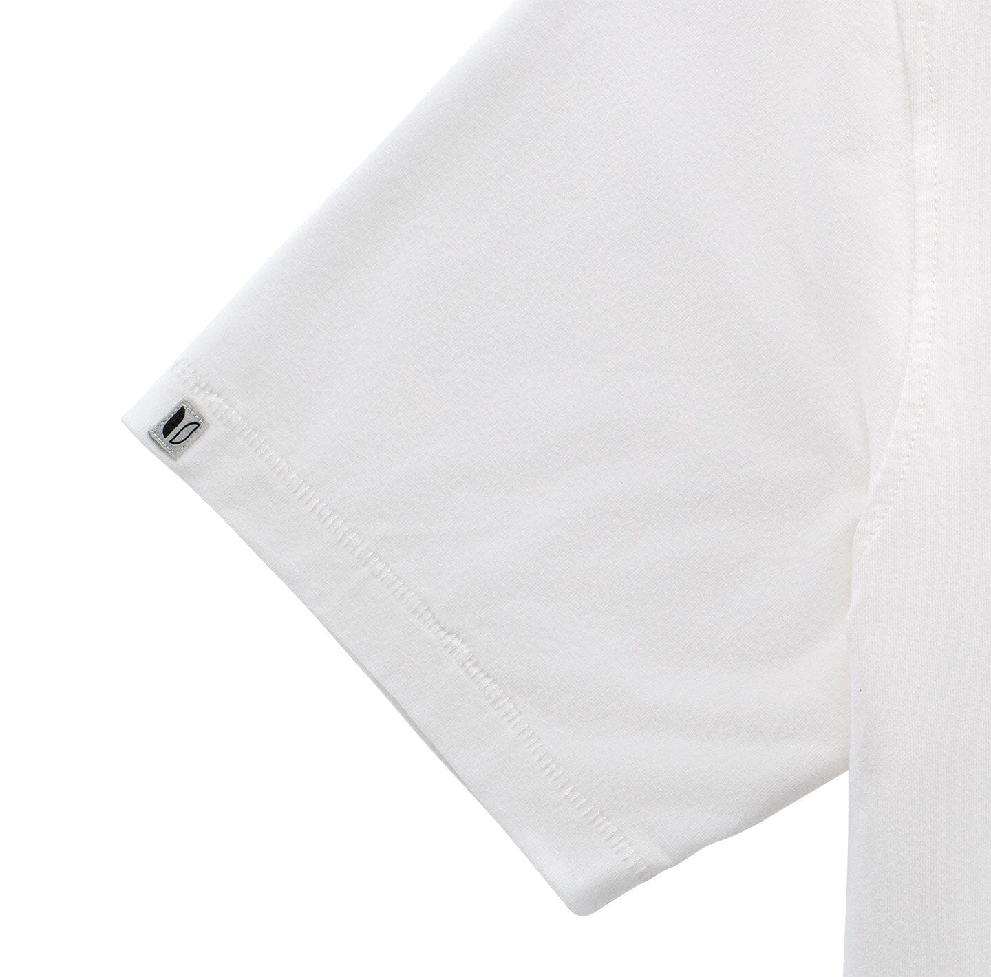 Sleeve cuff detail on the White Pacific Seawool Polo by LINKSOUL